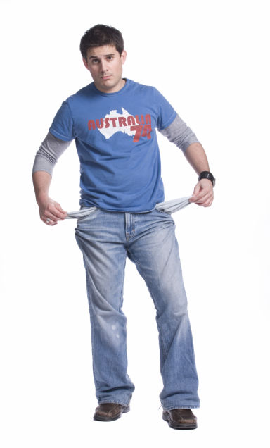 man standing with his pockets turned inside out showing he has no money